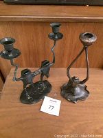 Both frog candleholders on wooden surface, shows size proportionality and details of design