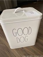 Front view of white metal dog food container with lid and GOOD DOG text