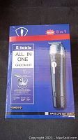 Box of 5-in-1 All In One Grooming Kit, model CWS-012, cordless with 60 minutes use and 2-hour charge time, new condition on packaging.