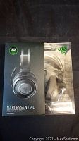 Front view of sealed Razer Nari Essential headset packaging, showing headset image and product name.
