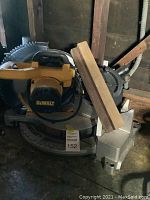 Front-left view of the miter saw showing motor housing and base