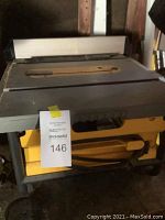 Front view of tabletop saw showing fence and table surface