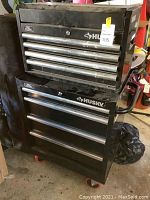 Front view showing both top and bottom units stacked, multiple drawers visible