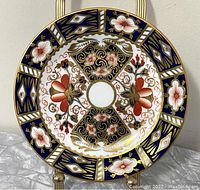 Front view of the antique Royal Crown Derby Imari plate showing the full decorative pattern with red, blue, white, and gold details.