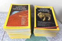 Stack of 45 National Geographic magazines showing front covers with yellow borders and classic topics like Mars and ancient tiger sculptures