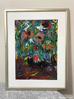 Frontal view of framed abstract oil painting showing mat and silver-tone frame