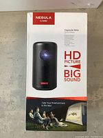 Front view of box showing product image and key features including HD picture, big sound, and tagline 'Take Your Entertainment to the Max'.