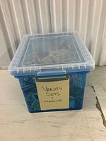 Side angle of the clear blue plastic bin labeled 'Vanity Sets & Make Up' showing card quantity and type inside.