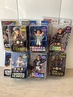 Front view of all six UFC action figures in original packaging showing each fighter and packaging details