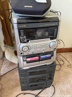Stacked AIWA and RCA stereo system units showing overall condition and components