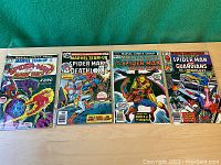 Seven Marvel Team-Up comic books from the 1970s featuring Spider-Man and other Marvel characters on the covers.