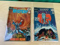 Two comic books side by side, showing full front covers in protective sleeves.
