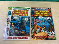 Two comic books shown front covers: 'Black Apache Rider Kid Outlaw Kid' and 'Black Rid Apache Kid Matt Slade'