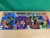 Four 1983 Marvel The Falcon comic books laid side by side showing front covers.