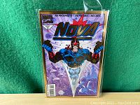 Front cover of Nova #1 comic book showing character Nova in blue and gold outfit with fists clenched. Gold foil border around cover.