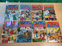 Displays 8 Silver Age Archie Comics including Laugh, Betty Veronica, The World of Jughead, and Archie titles.