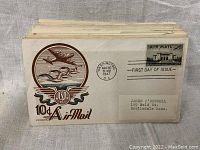 Stack of FDCs showing 10¢ Airmail cachet with twin planes and USA winged emblem