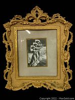 Front view of gilt painted cast iron ornate Victorian frame with the vintage Held Reutlinger photograph inside.