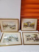 Set of four framed Parisian watercolor paintings showing various city scenes