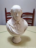 Front view of the vintage white bust sculpture showing the detailed facial features, beard, and period clothing.