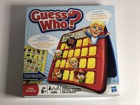 Front of the Guess Who? box showing the game board and character sheets.