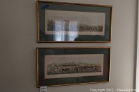 Two framed prints hung on wall depicting fox hunting scenes, attributed to H. Alken after T. Sutherland