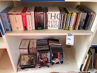 Overview of shelf with multiple classical music CD box sets and individual CDs visible, showing brand names and volumes of collections.