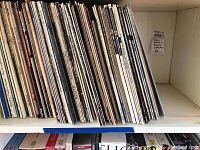 Shelf of vinyl LP spines showing numerous jazz, swing, blues albums