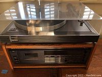 Full view of turntable on top shelf and cassette deck below