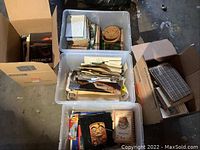 Overall view of four storage containers with books and papers