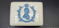 Top view of rectangular white porcelain trinket box showing raised blue relief profile portrait of HRH Duke of Edinburgh with crown and laurel wreath
