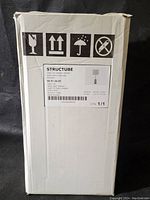 Original box showing shipping and care symbols and product label.