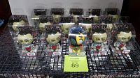 Fifteen Bobble Budds collectibles displayed in original sealed packaging, featuring Patient Zero Ninja vs Zombie characters mostly, and one Mega Man Elec Man figure.