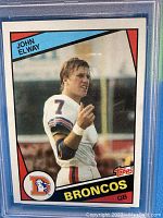Front of 1984 Topps John Elway football card in PSA graded holder.