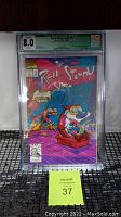 Front view of CGC graded Ren & Stimpy Show #1 comic book showcasing the cover art and autograph.