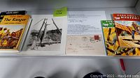 Photo showing the two hardcover books by Zane Grey, an 8x10 black and white photo print, the fan letter in envelope, and two Zane Grey Western magazines