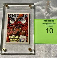 Front card protected in acrylic screw-mount case with auction tag visible.