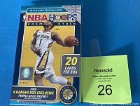 Front of sealed 2019-20 NBA Hoops Premium Stock basketball trading card hanger box featuring Ja Morant with branding and promotional text about exclusive Purple Disco Prizms.