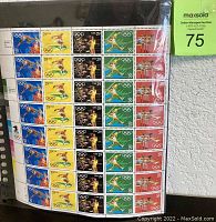 Full sheet of stamps with five columns by eight rows, showing colorful Olympic sport images on each stamp.