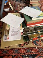 Stack of various bird books, some with labels 'BIRDS' and 'FERNS'.