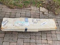 Sealed cardboard box labeled ‘1/3 Scale J3 Cub’ with pricing and ‘Show Special’ marking
