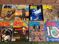 Photo showing eight Heavy Metal magazines with various fantasy and sci-fi cover art.