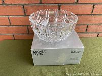 Vintage Mikasa crystal bowl on original Mikasa box against brick background, showing full bowl and box branding