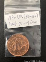 Front side of the coin showing ship design and date 1966 in a small plastic bag with label.