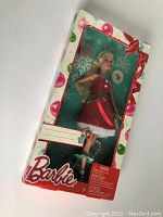 Full view of factory sealed Barbie Special Christmas doll box showing doll in red festive dress and decorated holiday box.