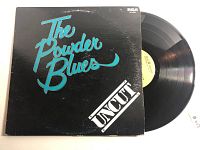 Front cover of The Powder Blues "Uncut" vinyl record showing band name and album title.
