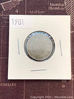 Obverse side of 1901 Liberty Head V Nickel coin showing Lady Liberty's head and the year 1901 in a protective holder.