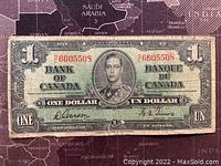 Front side of the banknote showing King George VI portrait, serial numbers, and text in English and French.