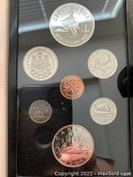 Front view of the 1975 Canadian silver specimen double dollar coin set in black holder, showing all coins faces with animal and emblem motifs and Queen Elizabeth II portraits.