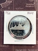 Obverse side of the 1982 Canadian proof dollar coin showing the portrait of Queen Elizabeth II, dated 1982, housed in a protective holder.
